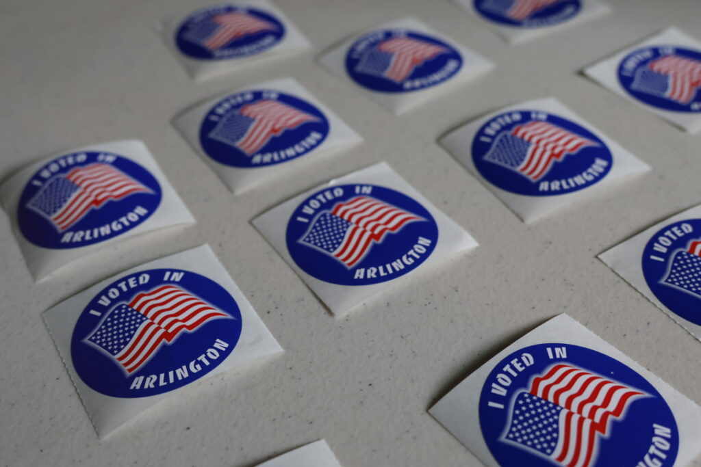 Stickers in Arlington County in June 2025. (Photo by Nathaniel Cline/Virginia Mercury)
