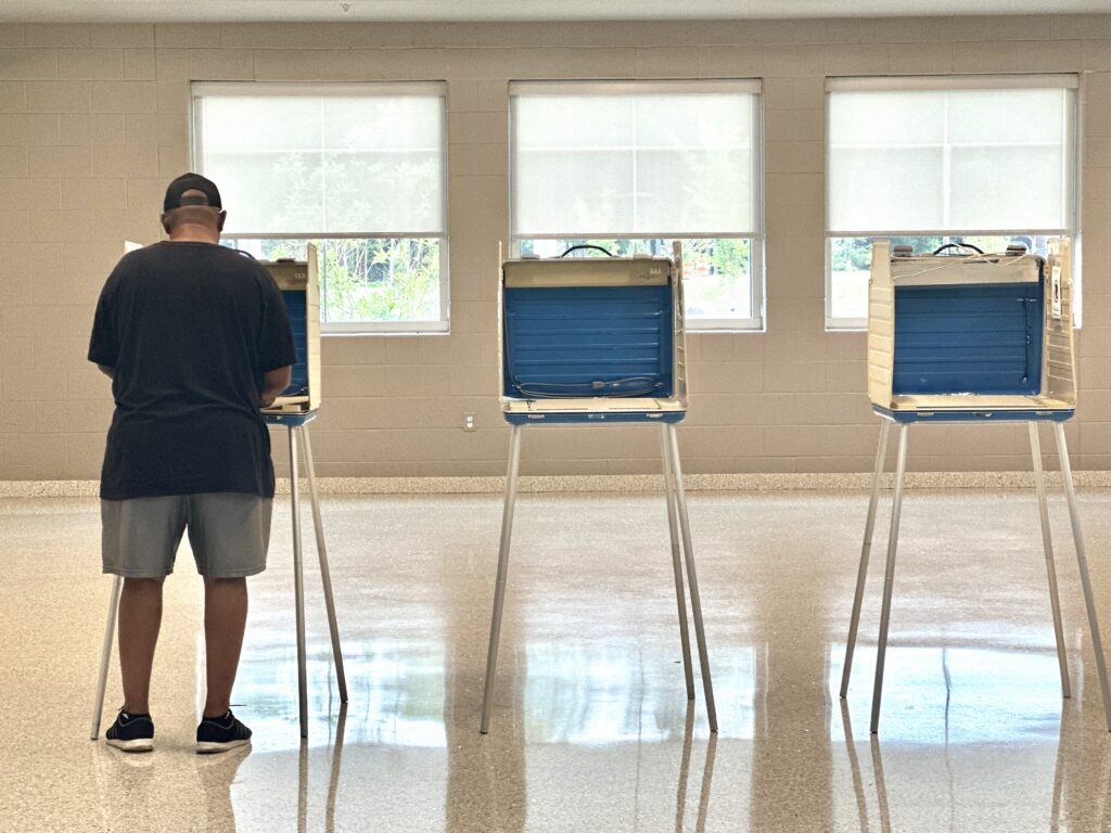 Voting at the Falling Creek Middle School precinct in Chesterfield County in the June 17, 2025, primary elections. (Photo by Markus Schmidt/Virginia Mercury)