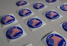 Rejected Virginia student voter registrations, Judge approves settlement Stickers in Arlington County in June 2025. (Photo by Nathaniel Cline/Virginia Mercury)