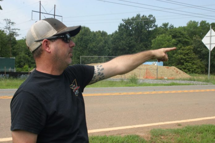 Austin Newsom explains how construction of a new Amazon data center campus across the street from his home has disrupted his life, July 2026. (Photo by Shannon Heckt/Virginia Mercury)