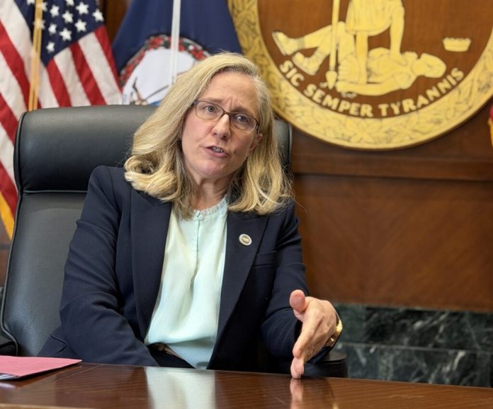 Gov. Abigail Spanberger speaks to reporters in Richmond. Spanberger announced Friday that her administration has restored voting and other civil rights to more than 66,000 Virginians since she took office in January. (Photo by Markus Schmidt/Virginia Mercury)