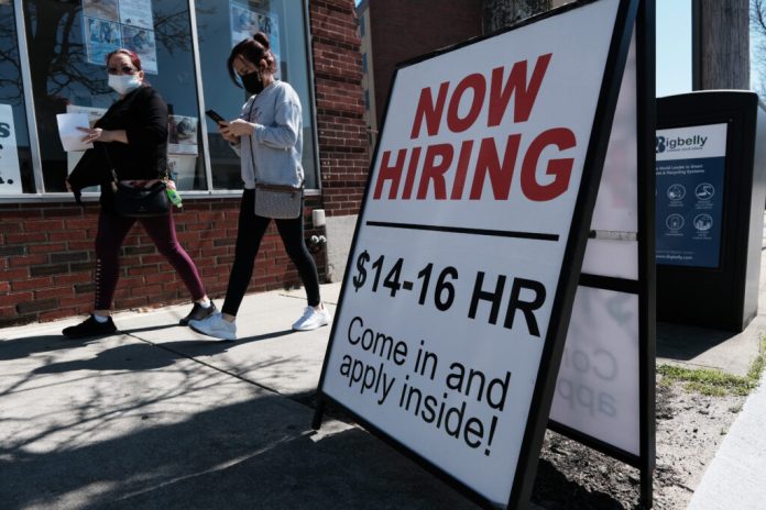 Virginia’s new pay transparency law requires employers to include salary ranges in job postings and prohibits them from asking applicants about their pay history. (Photo by Spencer Platt/Getty Images)