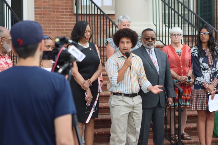 AD Carter, a former Shenandoah County Public Schools student, speaks in front of the Shenandoah County Circuit Court on June 11, 2024. Carter and other students sued the school board for reinstating Confederate names on several schools. (Photo by Nathaniel Cline/Virginia Mercury)