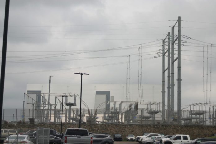 Transmission lines near a data center in Prince William County. (Photo by Shannon Heckt/Virginia Mercury)
