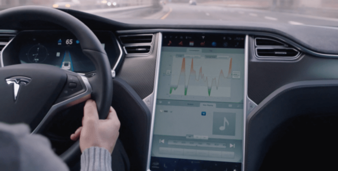 Tesla vehicles can operate in a semi-autonomous mode but a safety feature requires drivers to periodically apply pressure to the wheel with their hands. (Photo courtesy of Tesla)